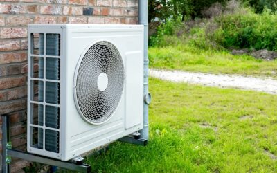 A Newly Installed Heat Pump—air Conditioner And Heating System In One—outside A Brick House In Texas.