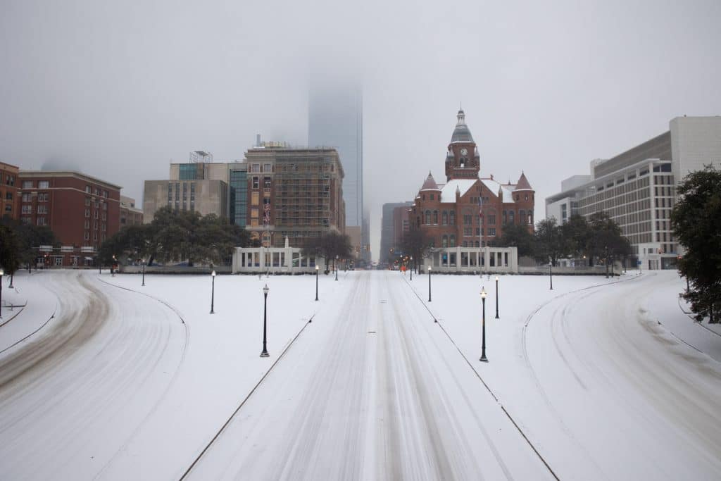 Snow-covered streets of downtown Dallas during a 2021 winter storm.