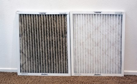 A clogged HVAC air filter next to a clean replacement filter, showing the buildup that can happen over a DFW winter.