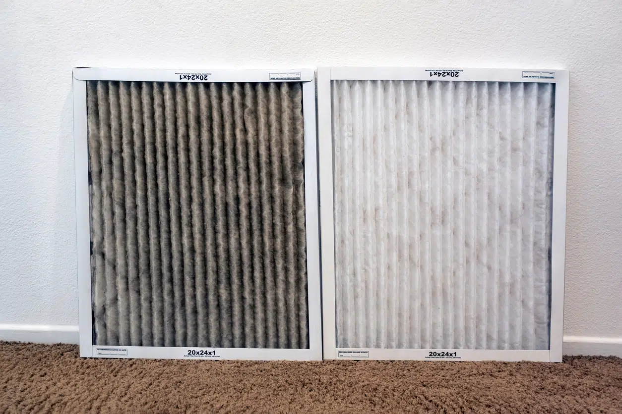 A clogged HVAC air filter next to a clean replacement filter, showing the buildup that can happen over a DFW winter.