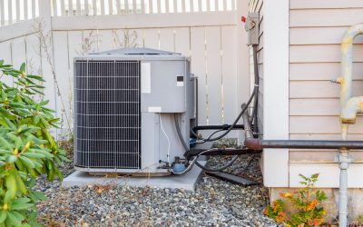A standard AC unit showing wear, a sign it's ready for a high-efficiency replacement.