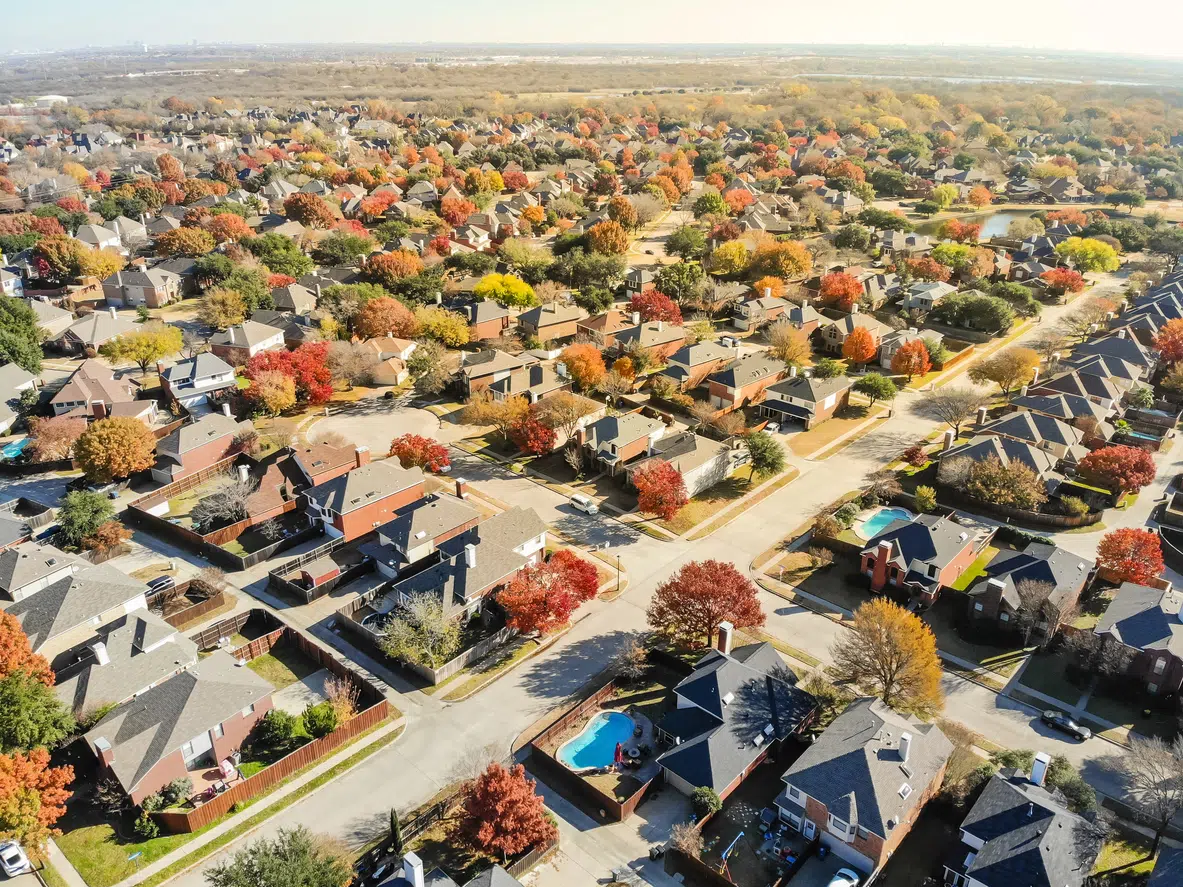 Aerial view of a Flower Mound neighborhood of large two-story homes, the kind that need even whole-house cooling